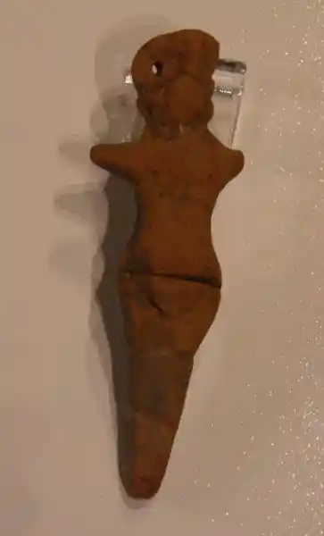 Red clay female figurine with pubic triangle